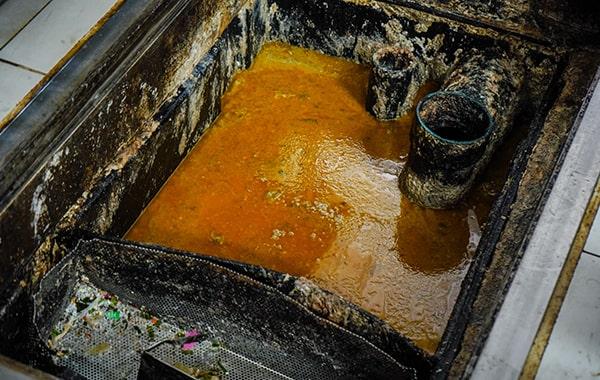 neglecting grease trap cleaning can lead to foul odors, clogs, and even fines for non-compliance with regulations